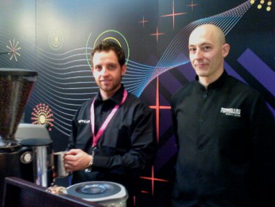 David and Manel the baristas posing near the coffee machine